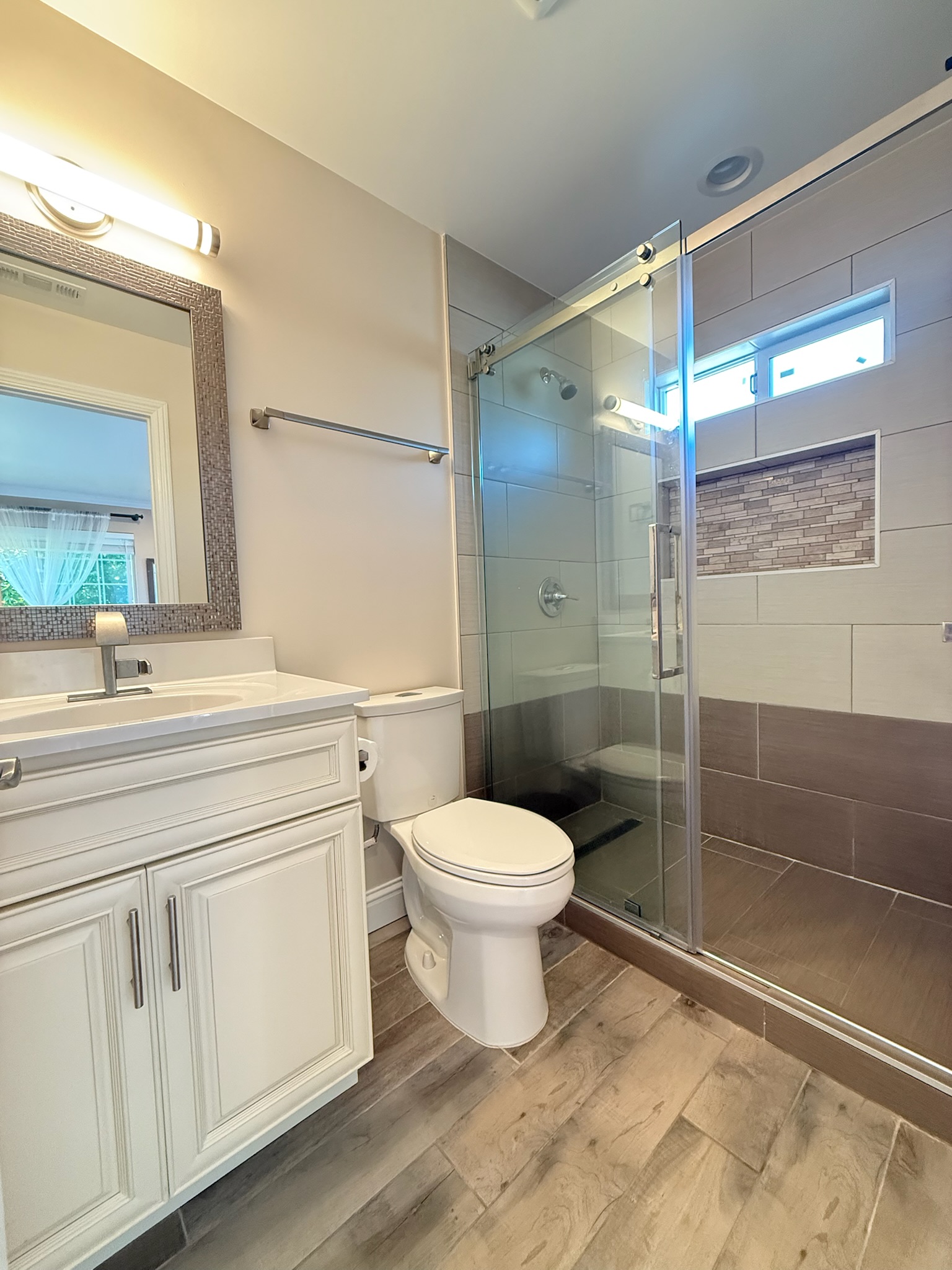 Full bathroom with glass shower enclosure