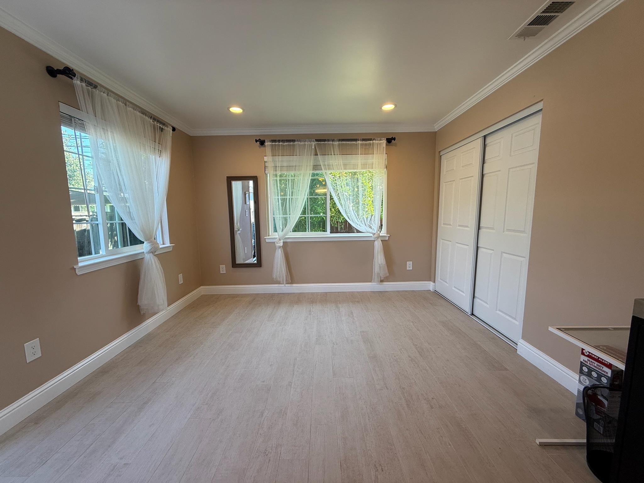Studio living space with windows and closet